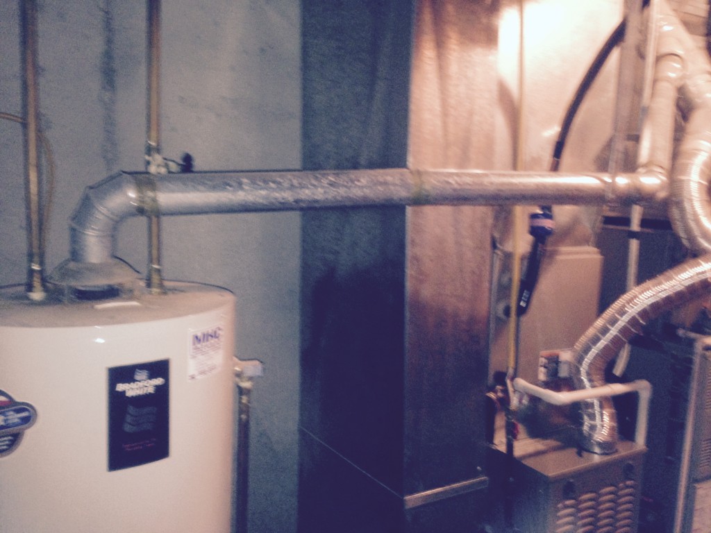 Not enough slope for gas water heater flue Water Heaters Installed by